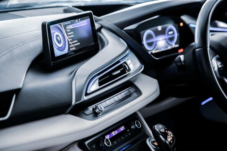 A modern touch-screen infotainment system and head unit fitted into a car dashboard console by a car stereo installation specialist in Sheffield.