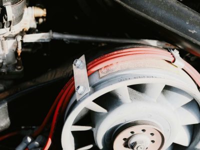 Detailed view of a vehicle electrical wiring loom and fuse box under the bonnet, showing professional car wiring repairs in Sheffield.