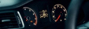 An orange engine light flashing on the dash of a car in Sheffield, indicating an urgent electrical fault requiring mobile diagnostics.