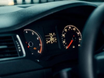 An orange engine light flashing on the dash of a car in Sheffield, indicating an urgent electrical fault requiring mobile diagnostics.